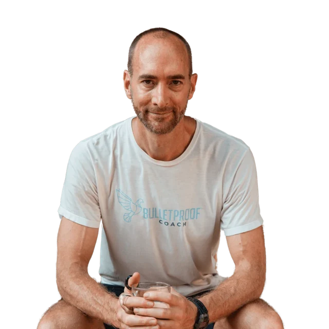 Jason Ryer seated in his Bulletproof Coach shirt
